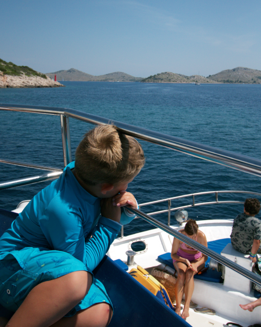 Young guest enjoying peaceful sea views during Flipper One’s island-hopping adventure.