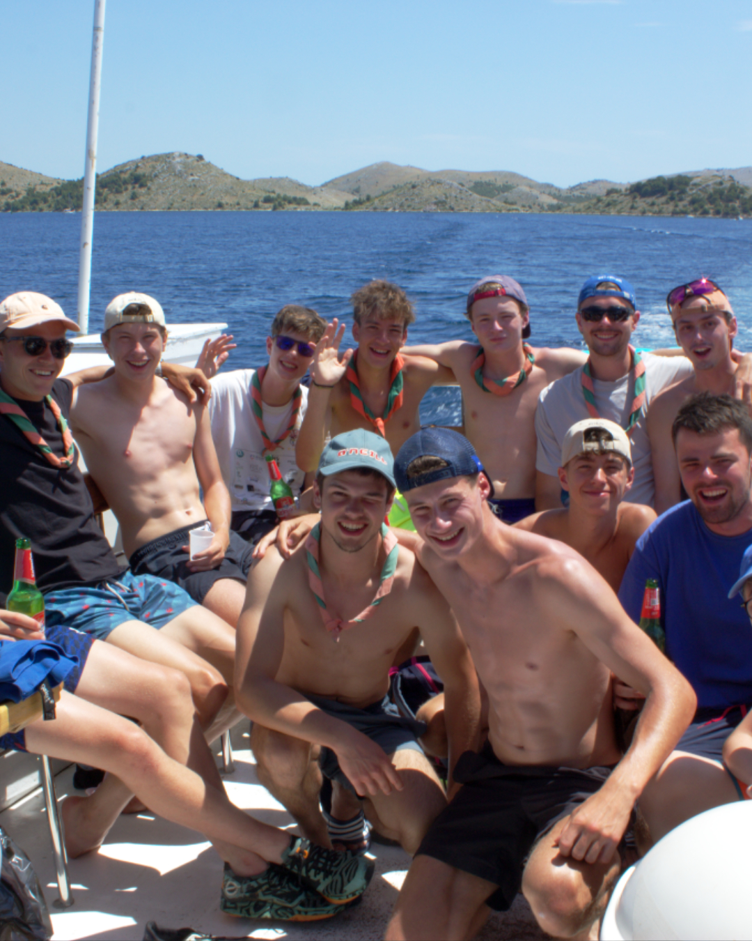 Happy boat guests capturing memories together during a summer trip through Kornati archipelago.