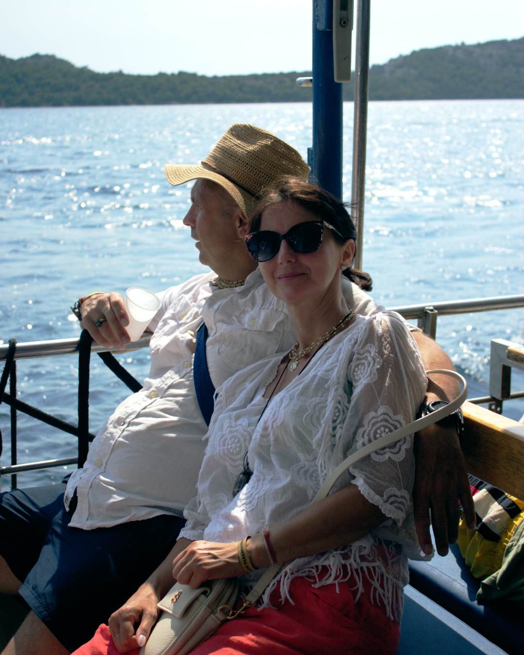 Older couple sitting peacefully on board Flipper One while cruising near Telašćica and Kornati islands.