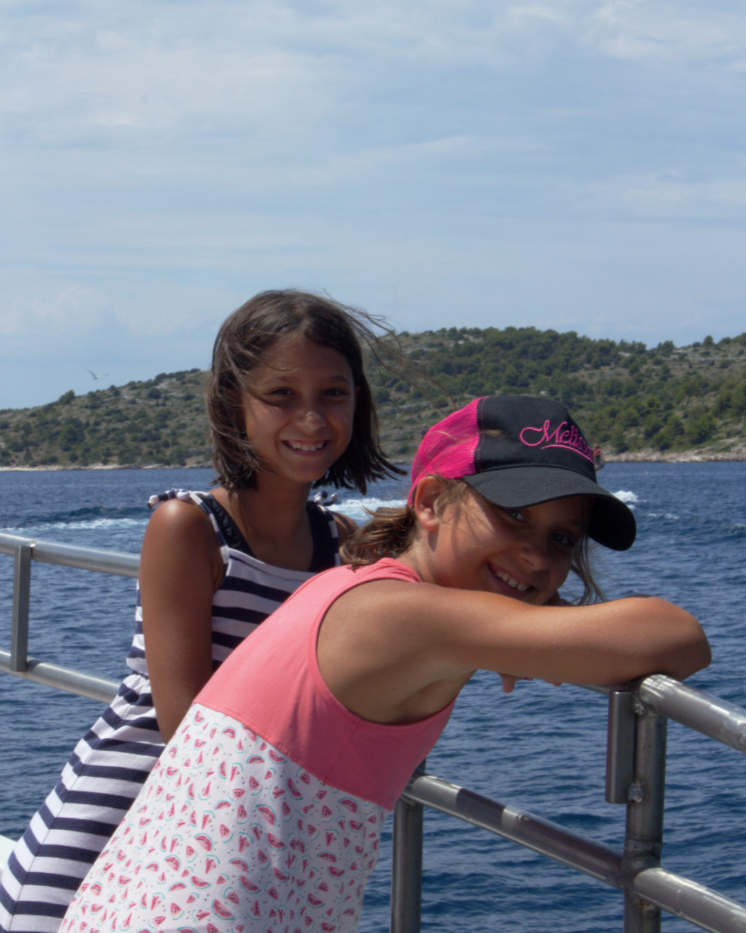 Summer breeze and laughter shared between friends on the deck of Flipper One near Kornati.