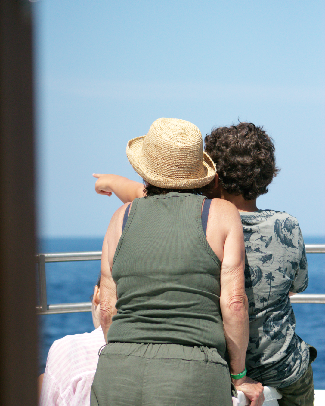 Shared wonder — guest and child admiring coastal views during Flipper One boat trip.