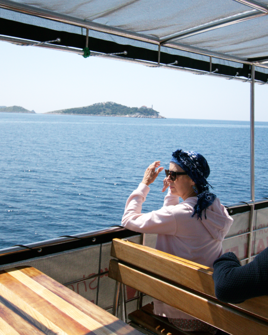 Quiet moment at sea — guest admiring open waters on board Flipper One during island cruise.