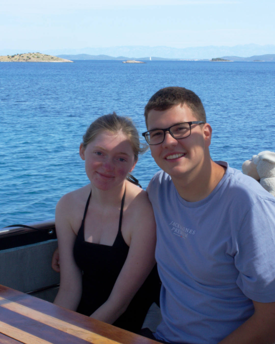 Couple enjoying ocean views aboard Flipper One during a boat tour through Kornati National Park.