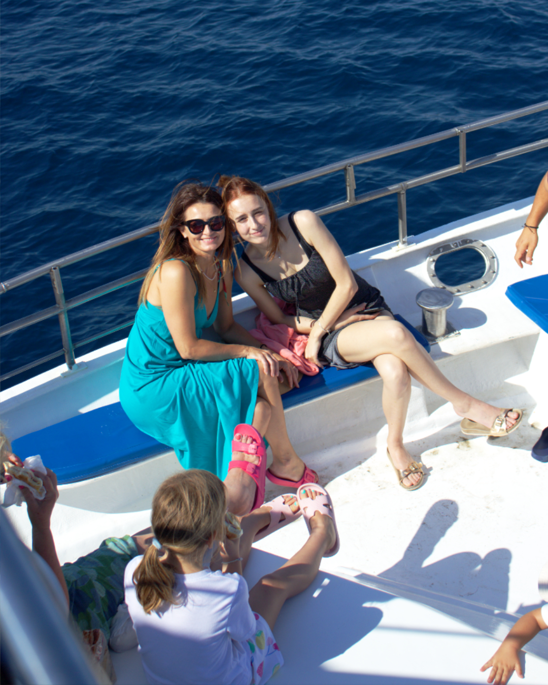 Friends relaxing and enjoying family time on a sunny boat trip through Croatia’s island paradise.
