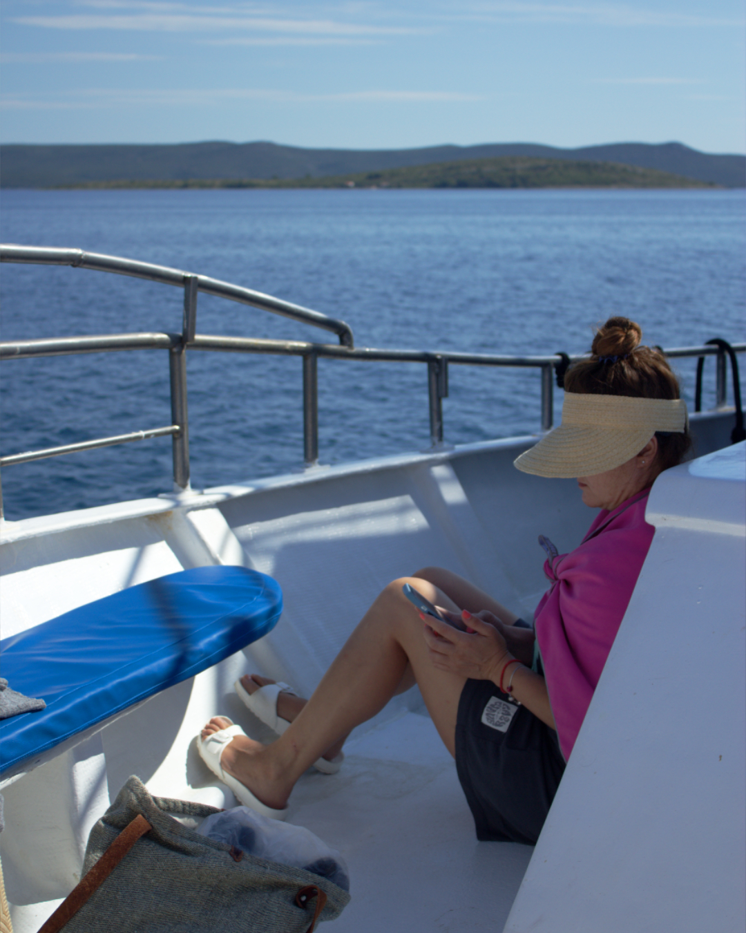 Passenger soaking in the peaceful boat ride while cruising through Kornati and Telašćica islands.